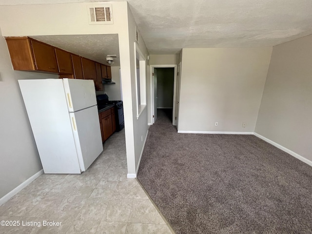 4143 Hillview Ave, Louisville, KY 40216 - kitchen featuring freestanding refrigerator, black gas range, baseboards, and a textured ceiling