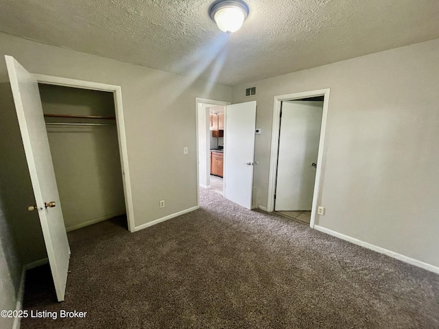 4143 Hillview Ave, Louisville, KY 40216 - unfurnished bedroom with carpet, a textured ceiling, baseboards, and a closet