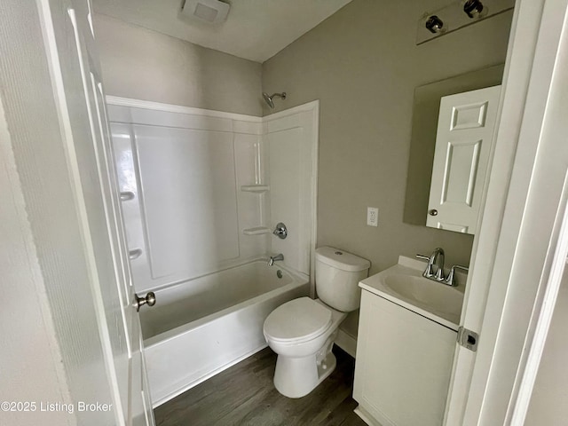 4143 Hillview Ave, Louisville, KY 40216 - full bathroom featuring vanity, toilet, tub / shower combination, and wood finished floors