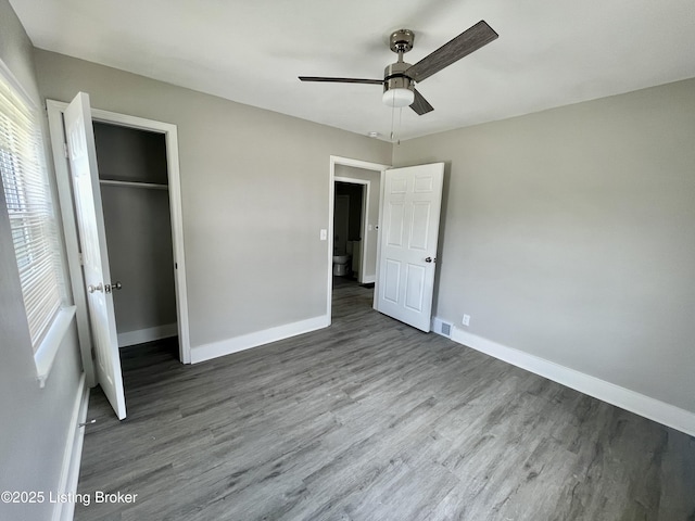 4143 Hillview Ave, Louisville, KY 40216 - unfurnished bedroom with baseboards, wood finished floors, and a closet
