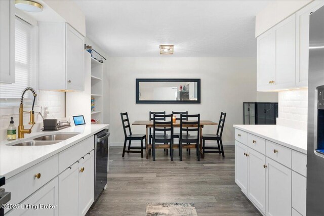 812 Castlewood Dr, New Albany, IN 47150 - kitchen with a sink, decorative backsplash, light countertops, and white cabinets