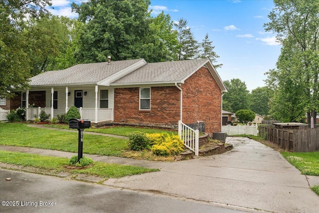 812 Castlewood Dr, New Albany, IN 47150 - ranch-style home with concrete driveway, a porch, brick siding, and a shingled roof