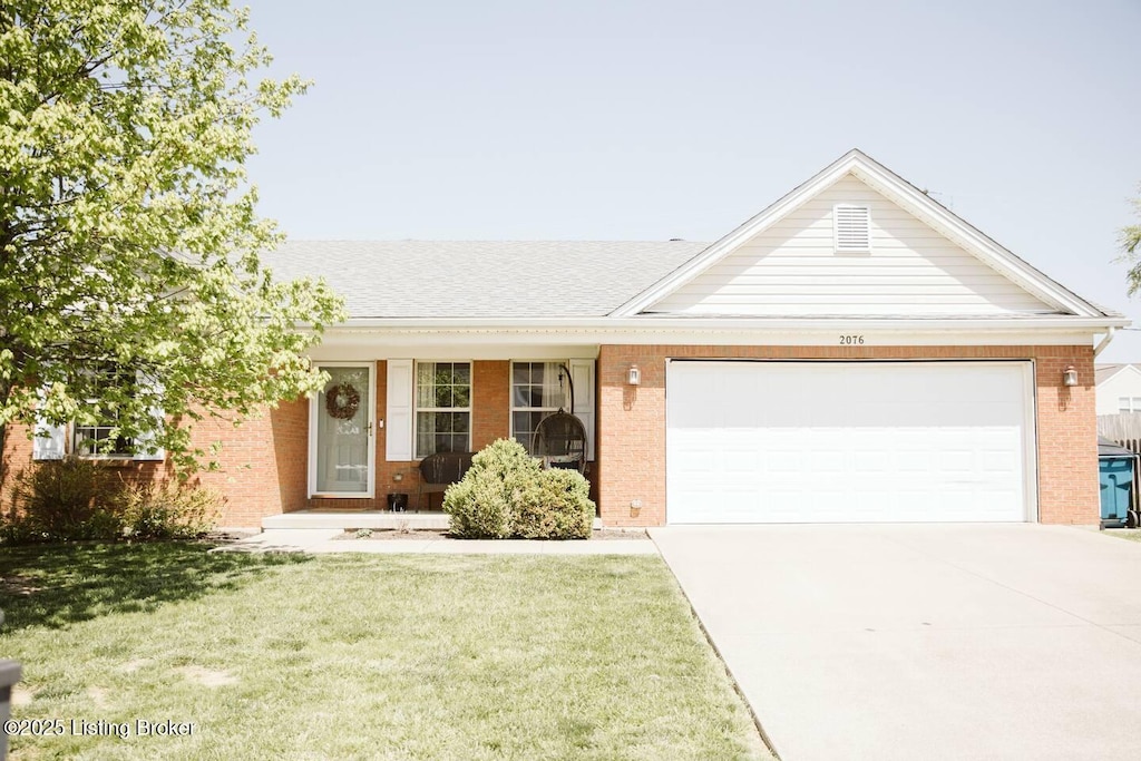 2076 Osprey Cv, Shelbyville, KY 40065 - ranch-style home with brick siding, a garage, concrete driveway, a front lawn, and a shingled roof