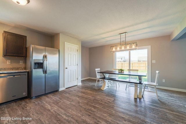 108 Ruby Farm Dr, Mt Washington, KY 40047 - kitchen featuring stainless steel appliances, dark wood-style flooring, baseboards, pendant lighting, and dark brown cabinets