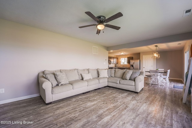 108 Ruby Farm Dr, Mt Washington, KY 40047 - living room featuring wood finished floors, baseboards, and a ceiling fan