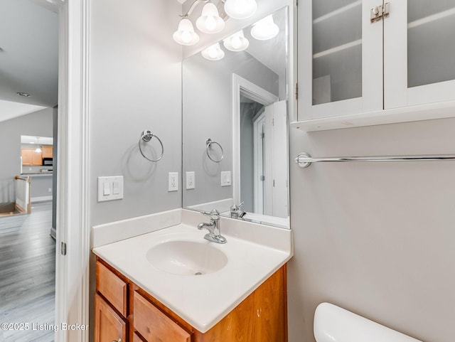 14409 Estate Ridge Blvd, Louisville, KY 40291 - bathroom featuring vanity, toilet, wood finished floors, and a chandelier