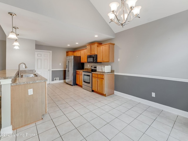 14409 Estate Ridge Blvd, Louisville, KY 40291 - kitchen with appliances with stainless steel finishes, a sink, vaulted ceiling, recessed lighting, and baseboards
