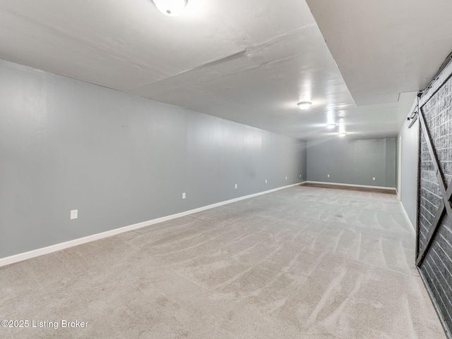14409 Estate Ridge Blvd, Louisville, KY 40291 - finished below grade area with carpet floors, baseboards, and a barn door