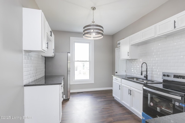 125 N Walnut St, Cynthiana, KY 41031 - kitchen featuring stainless steel appliances, a sink, a chandelier, tasteful backsplash, and dark countertops