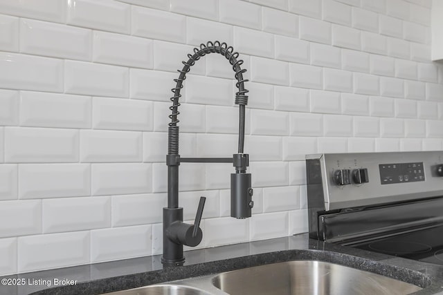 125 N Walnut St, Cynthiana, KY 41031 - kitchen view of a sink, backsplash, and dark stone countertops