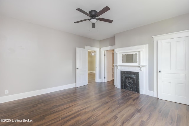 125 N Walnut St, Cynthiana, KY 41031 - unfurnished living room with a ceiling fan, dark wood-type flooring, a high end fireplace, and baseboards