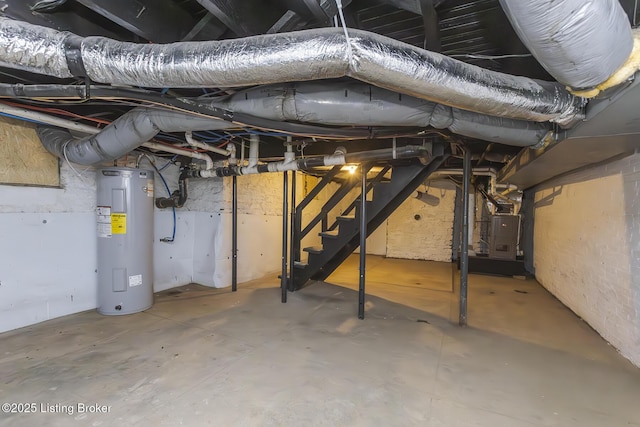 125 N Walnut St, Cynthiana, KY 41031 - unfinished basement featuring electric water heater, stairway, and heating unit
