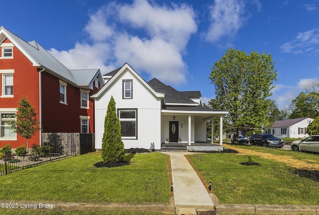 125 N Walnut St, Cynthiana, KY 41031 - view of front facade with a porch and board and batten siding