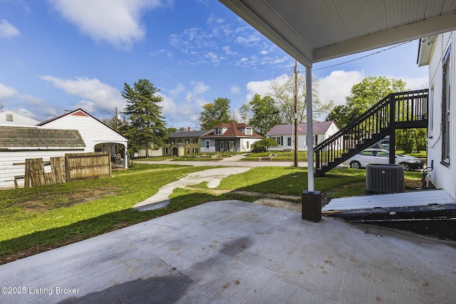 125 N Walnut St, Cynthiana, KY 41031 - view of patio with a residential view, stairway, and cooling unit
