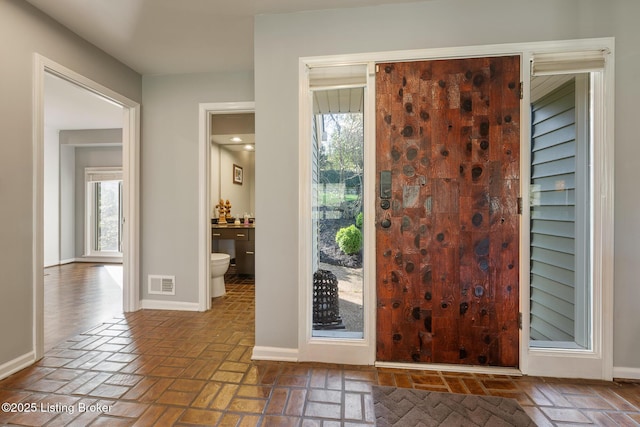 1140 Rostrevor Cir, Louisville, KY 40205 - entrance foyer with brick floors and baseboards