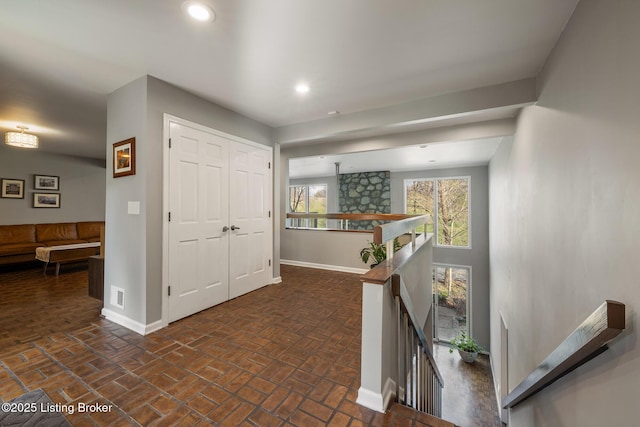 1140 Rostrevor Cir, Louisville, KY 40205 - hallway with an upstairs landing, baseboards, recessed lighting, and brick patterned flooring