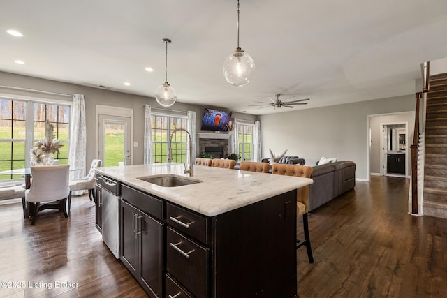 6803 Park Vista Way, Louisville, KY 40229 - kitchen featuring a sink, a fireplace, open floor plan, stainless steel dishwasher, and recessed lighting