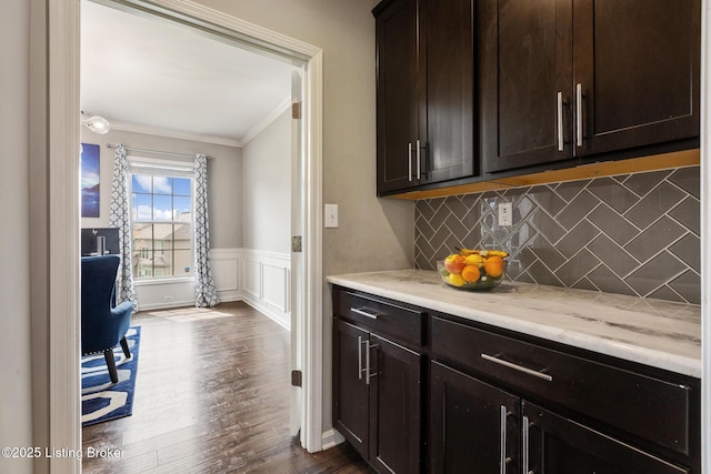 6803 Park Vista Way, Louisville, KY 40229 - kitchen featuring ornamental molding, tasteful backsplash, dark wood finished floors, dark brown cabinetry, and a wainscoted wall