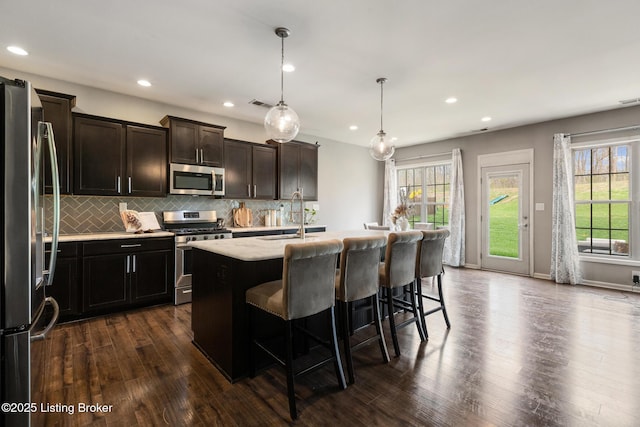 6803 Park Vista Way, Louisville, KY 40229 - kitchen with appliances with stainless steel finishes, a sink, healthy amount of natural light, dark wood-style flooring, and recessed lighting