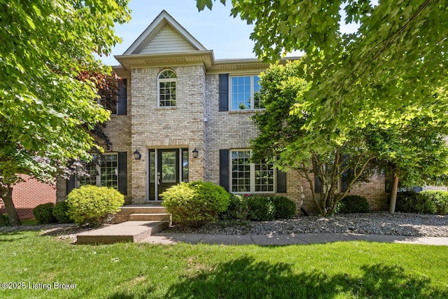 4705 Holly Forest Ct, Louisville, KY 40245 - colonial-style house featuring a front lawn and brick siding