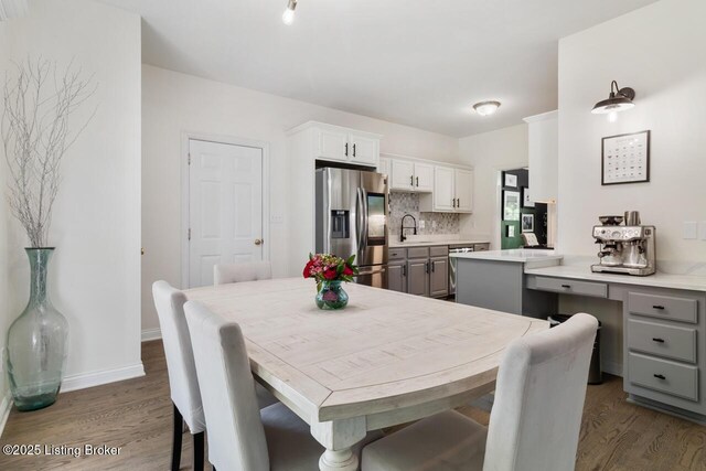 4705 Holly Forest Ct, Louisville, KY 40245 - dining space with dark wood-type flooring and baseboards