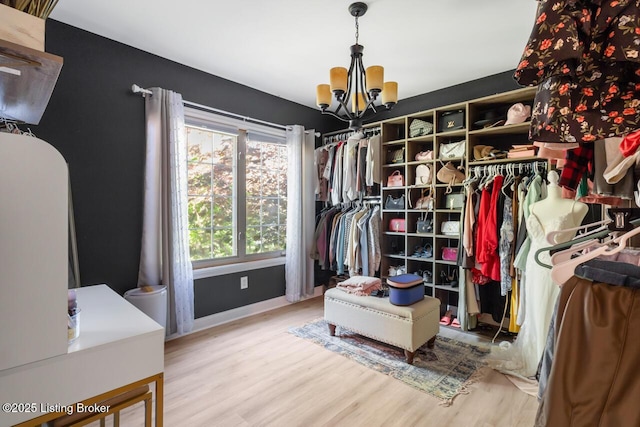 4705 Holly Forest Ct, Louisville, KY 40245 - spacious closet featuring a chandelier and wood finished floors