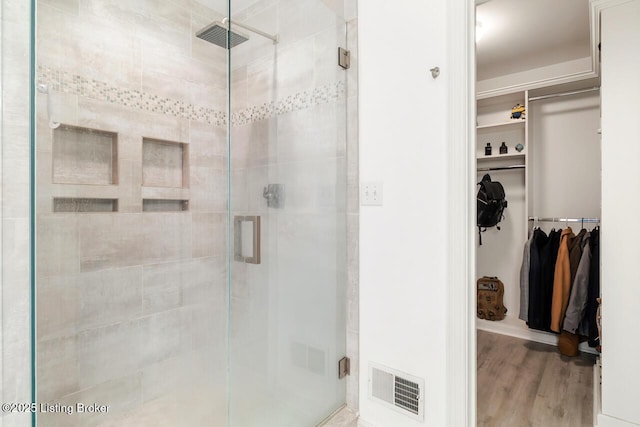 4705 Holly Forest Ct, Louisville, KY 40245 - full bathroom with a stall shower, wood finished floors, and a walk in closet