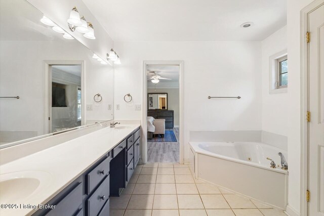 4705 Holly Forest Ct, Louisville, KY 40245 - full bathroom featuring double vanity, tile patterned floors, a whirlpool tub, ensuite bathroom, and ceiling fan