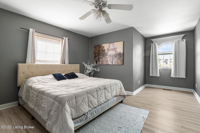 4705 Holly Forest Ct, Louisville, KY 40245 - bedroom with wood finished floors, baseboards, and ceiling fan