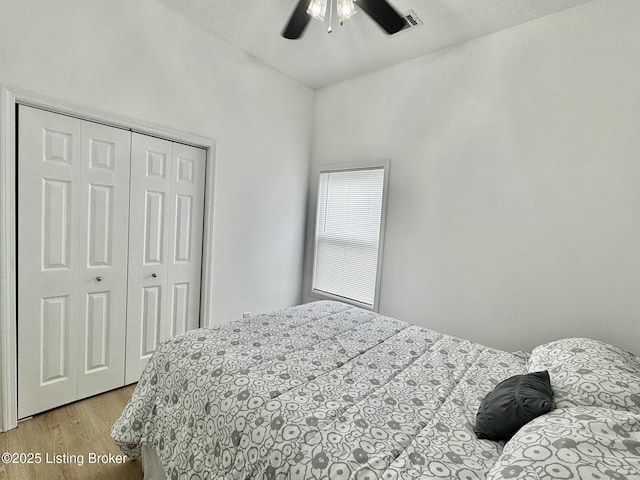 445 Marret Ave, Louisville, KY 40208 - bedroom with light wood-style floors, a closet, and a ceiling fan