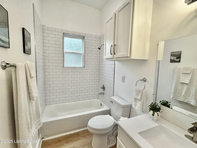 445 Marret Ave, Louisville, KY 40208 - bathroom featuring toilet, shower / bathtub combination, vanity, and wood finished floors