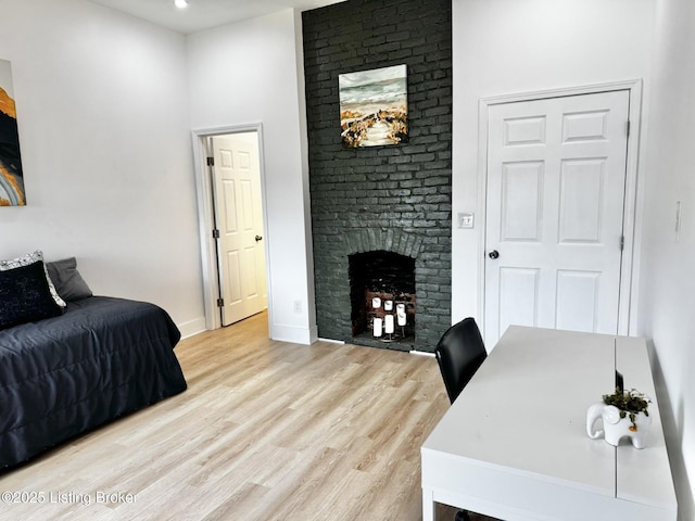 445 Marret Ave, Louisville, KY 40208 - bedroom with a fireplace, light wood-style flooring, baseboards, and recessed lighting