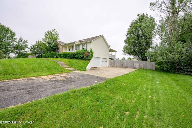 198 Cecilia Smiths Mill Rd, Cecilia, KY 42724 - view of front of home featuring a garage and asphalt driveway
