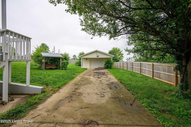 198 Cecilia Smiths Mill Rd, Cecilia, KY 42724 - view of yard featuring a garage, an outdoor structure, and concrete driveway