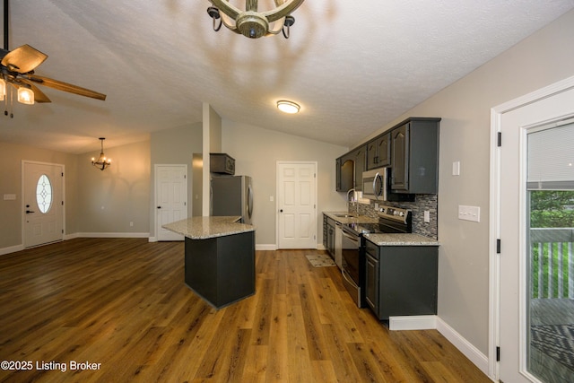 198 Cecilia Smiths Mill Rd, Cecilia, KY 42724 - kitchen featuring appliances with stainless steel finishes, a chandelier, dark wood-style flooring, baseboards, and plenty of natural light