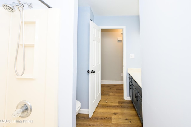 198 Cecilia Smiths Mill Rd, Cecilia, KY 42724 - bathroom featuring wood finished floors, a shower, toilet, vanity, and baseboards