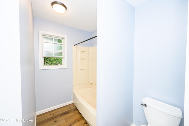 198 Cecilia Smiths Mill Rd, Cecilia, KY 42724 - bathroom with wood finished floors, baseboards, toilet, and tub / shower combination