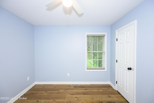 198 Cecilia Smiths Mill Rd, Cecilia, KY 42724 - unfurnished room with wood finished floors, baseboards, and a ceiling fan