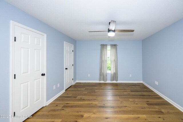 198 Cecilia Smiths Mill Rd, Cecilia, KY 42724 - empty room with wood finished floors, baseboards, and ceiling fan