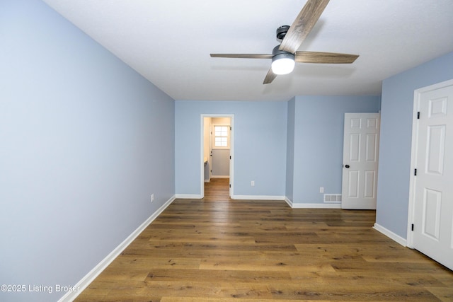 198 Cecilia Smiths Mill Rd, Cecilia, KY 42724 - unfurnished bedroom with wood finished floors, baseboards, and ceiling fan