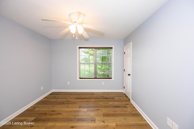 198 Cecilia Smiths Mill Rd, Cecilia, KY 42724 - spare room featuring wood finished floors, a ceiling fan, and baseboards