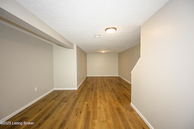 198 Cecilia Smiths Mill Rd, Cecilia, KY 42724 - hall featuring wood finished floors, baseboards, and a textured ceiling