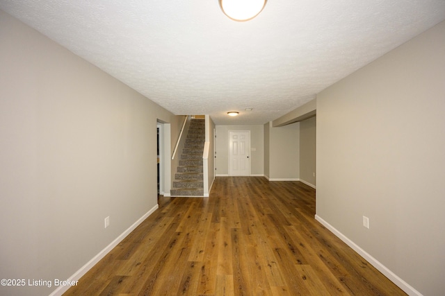 198 Cecilia Smiths Mill Rd, Cecilia, KY 42724 - empty room with stairs, baseboards, wood finished floors, and a textured ceiling