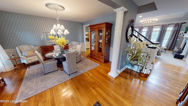 103 Morgan Ct, Bardstown, KY 40004 - dining space with a chandelier, wallpapered walls, ornate columns, and wood finished floors