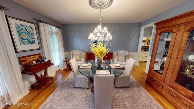 103 Morgan Ct, Bardstown, KY 40004 - dining room featuring a chandelier, wood finished floors, wallpapered walls, and wainscoting