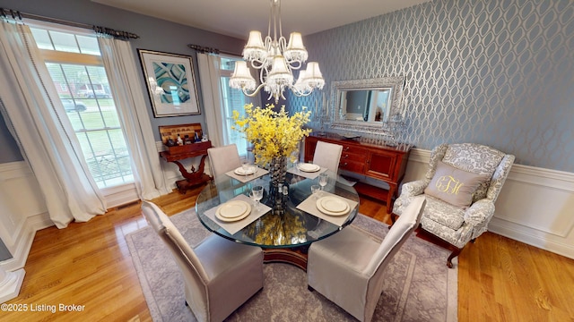 103 Morgan Ct, Bardstown, KY 40004 - dining space featuring a chandelier, wood finished floors, plenty of natural light, a decorative wall, and wallpapered walls