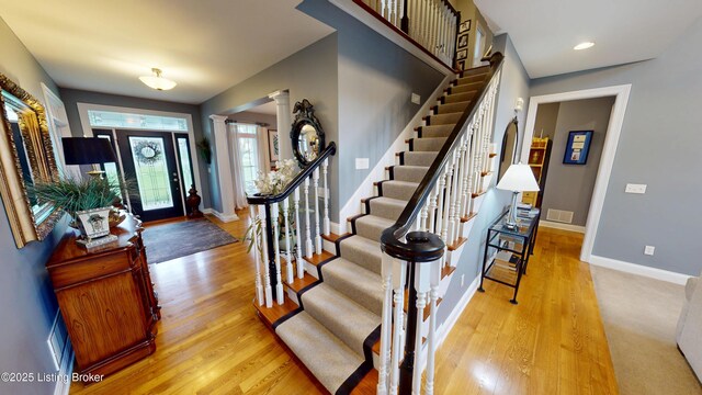 103 Morgan Ct, Bardstown, KY 40004 - entryway with stairway, wood finished floors, baseboards, and decorative columns
