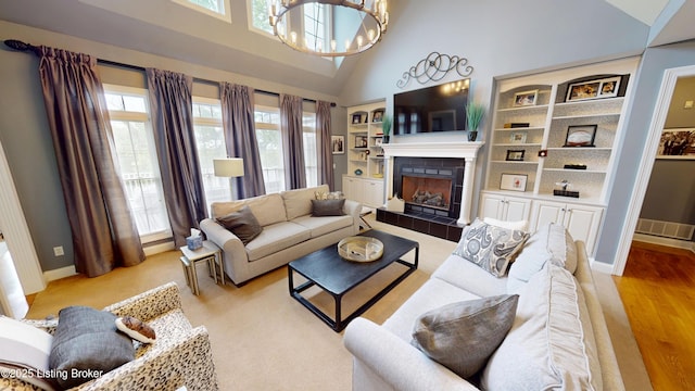 103 Morgan Ct, Bardstown, KY 40004 - living room with a fireplace, high vaulted ceiling, baseboards, light wood-style floors, and a chandelier