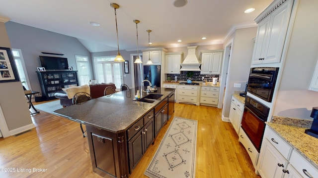 103 Morgan Ct, Bardstown, KY 40004 - kitchen with black appliances, custom range hood, a sink, dark brown cabinets, and light wood finished floors
