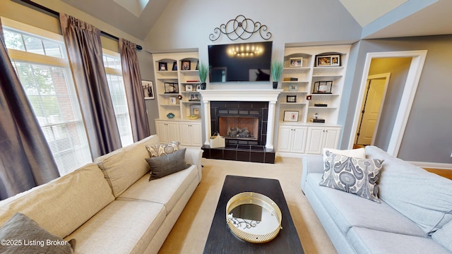 103 Morgan Ct, Bardstown, KY 40004 - living area with vaulted ceiling, a tiled fireplace, baseboards, carpet flooring, and built in features